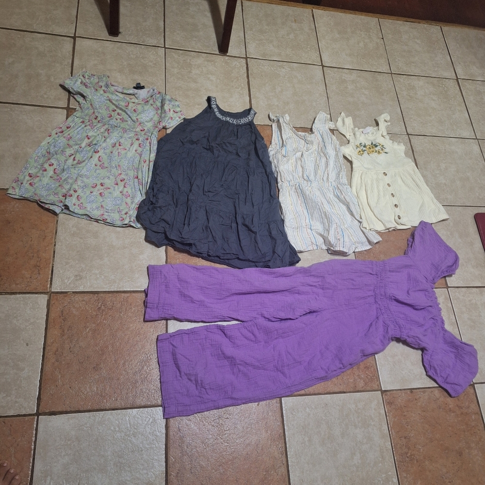 Charming Floral Kids Blouse The jumpsuit has some small white spots on the pants